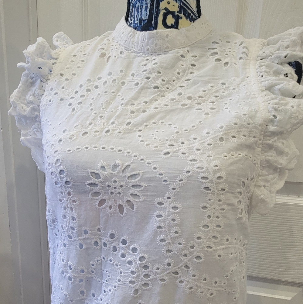 Little white eyelet dress.